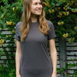 Load image into Gallery viewer, Model wears a charcoal short sleeve crew neck Hip length T-shirt