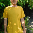 Load image into Gallery viewer, Male model wears a golden yellow short sleeve crew neck T-shirt