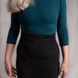 Load image into Gallery viewer, Waist detail of black hemp stretch pencil skirt.