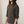 Load image into Gallery viewer, A handsome young man with long hair wears a charcoal grey hooded long sleeve pullover top with the sleeves pushd up
